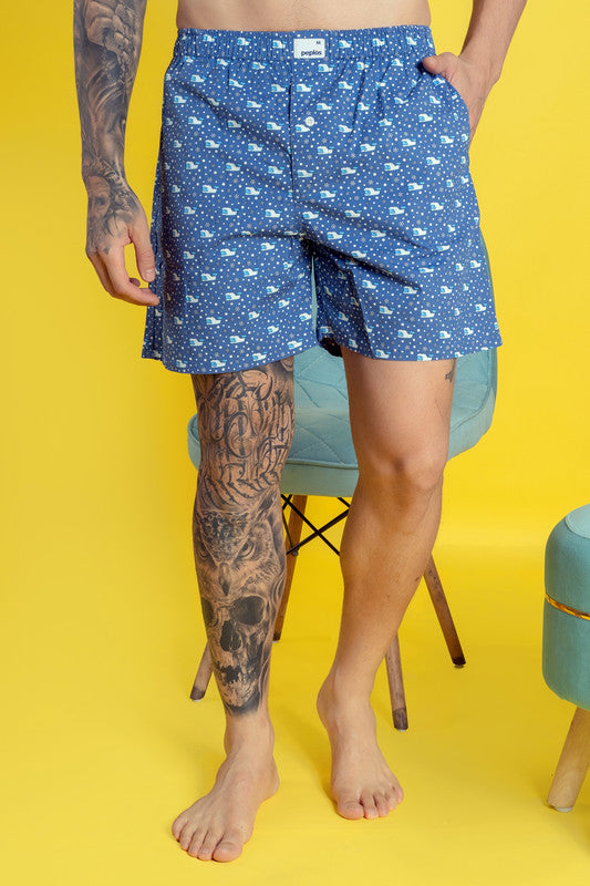 Blue cotton men's boxers with elasticated waist and printed design.