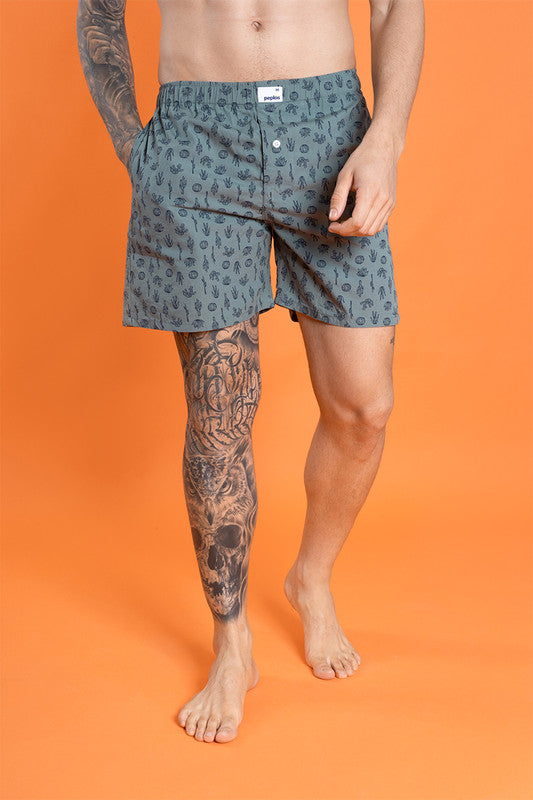 Green cotton men's boxers with elasticated waist and printed pattern.