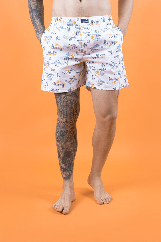 White men's boxers with printed design, cotton fabric, and elastic waistband.
